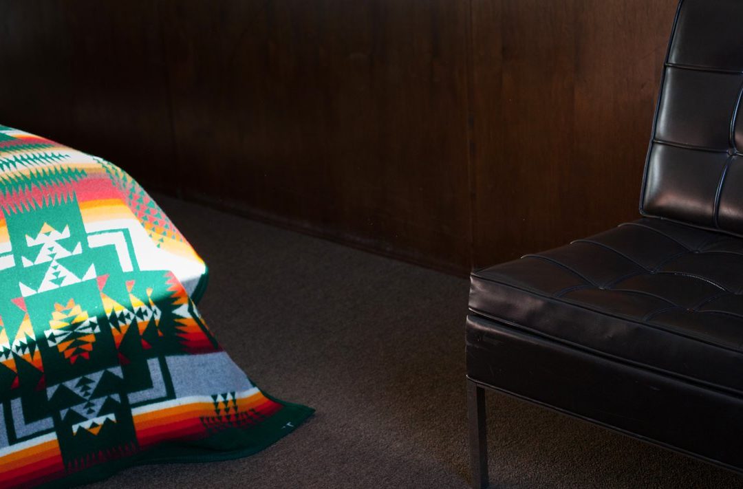 A chair and an Ace Hotel blanket