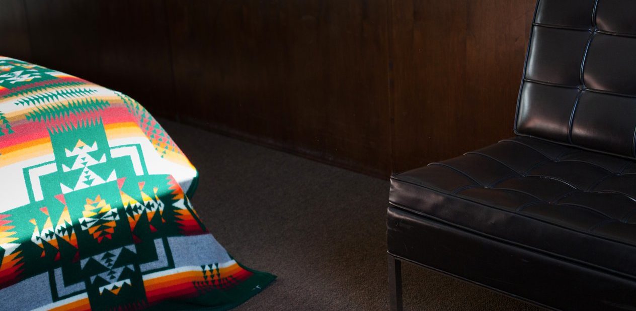 A chair and an Ace Hotel blanket